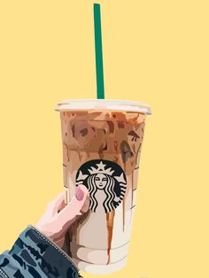 a hand holding a starbucks drink with chocolate drizzled on it