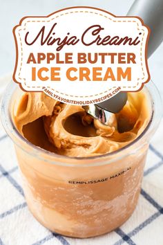 an apple butter ice cream in a glass container with a spoon and label on top