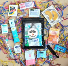 the contents of a diaper bag laid out on a colorful cloth with text overlay