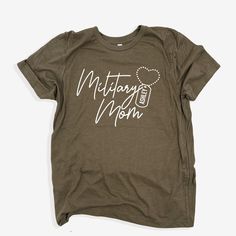 Personalized Military Mom shirt, Military Mom gift, Proud Military Mom T-shirt, Custom Military Mom tee, Mama Military gift, Deployment gift, Army Mom Tee  👚How To Order Your Apparel 👕 This is a physical item which means once you purchase, receive an order confirmation and tracking within 3-5 days. You will be able to track your item once it is updated with a tracking number which you can find in your purchases section.  🗳 How we print our apparel  ➡️ We do not carry pre-printed shirts.  Once you place your order it goes into our production process with our production partner. We print our shirts using Direct To Garment printing technology. Unlike other garments decorating processes, this process allows for a super soft print that will last for years. The ink is eco and kid friendly.  P Cotton T-shirt With Screen Print For Gift, Cotton T-shirt With Screen Print As Gift, Graphic Tee Crew Neck T-shirt As Gift, Mother's Day Screen Print Crew Neck T-shirt, Mother's Day Green Short Sleeve T-shirt, Green Short Sleeve T-shirt For Mother's Day, Mother's Day Gift Cotton T-shirt, Crew Neck Shirt With Screen Print As Gift, Graphic Tee T-shirt As Gift In Green