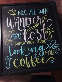 a sign that says not all who wander are lost some are just looking for coffee