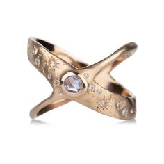 Guard your own little galaxy in this stellar 14k rose gold ring from Sirciam. A round 0.12ct light blue sapphire is bezel set at the nexus of the star-crossed X shaped band. Scattered white diamonds totaling 0.10cttw carry the light of a million dreams. Size 8. Handcrafted in Los Angeles, CA, U.S. Flare Ring, A Million Dreams, Star Rings, Million Dreams, Light Blue Sapphire, Galaxy Ring, Ring Inspiration, Star Crossed, 14k Rose Gold Ring