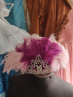 Vintage show headdress with pink feathers, bit distressed 3 rhinestones missing. Has a ton of wear. Great boudoir decor, brokante theater decor Pink Carnival Headpieces, Pink Feathered Headpieces For Evening, Pink Feather Trim Headpieces For Party, Pink Crown Headpiece For Wedding, Pink Wedding Crown Headpiece, Pink Carnival Headpieces For Party, Pink Headpieces For Carnival Party, Pink Carnival Party Headpiece, Vintage Pink Costume Hats And Headpieces For Wedding