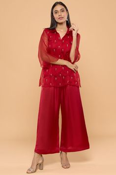 Featuring a red top in modal satin and organza base with embroidery. It is paired with matching pants. . #perniaspopupshop #whatiworewastrending #ppuslove #mayukothari #pantset Organza Collar, Aisha Rao, Organza Kurta, Layered Kurta, Organza Shirt, Embroidered Roses, Palazzo Set, Satin Pants, Tarun Tahiliani