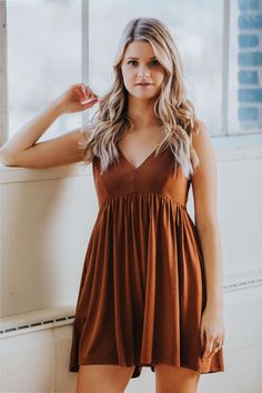 Details-Ultra soft romper in camel-Side pockets-Adjustable straps-Elastic back and waist-72% modal, 24% polyester, 4% spandex Size + Fit-Bust: 32", Waist: 32", Inseam: 3" -Measurements taken from a size Small -Model is 5'4 and wearing a size Small Brown Summer Jumpsuits And Rompers For Loungewear, Summer Brown Jumpsuits And Rompers For Loungewear, Sleeveless Brown Jumpsuit For Day Out, Brown V-neck Jumpsuits And Rompers For Loungewear, Adjustable Straps, Camel, Casual Dress, Rompers, How To Wear