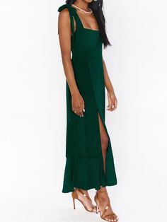 Make a daring statement in our AVIANCA Shoulder Tie Bridal Midi Dress in luxe emerald. This alluring bridal inspired midi dress features the signature AVIANCA shoulder tie detailing and rich claret fabric with a delicate shimmer, creating a sophisticated and exclusive look for the fashion-forward bride. Crafted with a luxurious feel, this dress is sure to dazzle on your special day or wedding guests. Size Guide: Model is 5’6” tall, and has a 33.4” bust, 26.5” waist, & 34.6” hips. She is wearing Form-fitting Dark Green Dress For Wedding, Fitted Dark Green Dress For Wedding, Elegant Green Dress With Sweetheart Neckline, Fitted Dark Green Wedding Dress, Elegant Dark Green Wedding Dress, Green Maxi Dress With Sweetheart Neckline For Evening, Elegant Dark Green Prom Dress, Green Dresses For Date Night With Fitted Bodice, Green Maxi Dress With Fitted Bodice