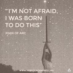 a person holding up a pole with the words i'm not afraid, i was born to do this