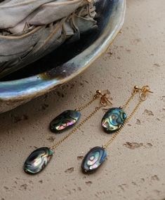 Holy Abalone-y, these are COOL.  Measuring 2 1/2 inch back drop length, 1 1/2 front drop length with genuine Abalone shells measuring approximately 1 1/2-2cm x 1cm. Made with 14k gold fill materials, very light weight, tarnish resistant, and hypoallergenic. Abalone Jewelry, Abalone Earrings, Dangle Earrings Gold, Jewelry Chain, Gold Filled Earrings, Huggie Earrings, Gold Earrings Dangle, Abalone Shell, Chain Earrings