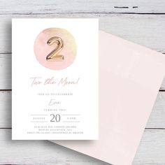 a pink and gold two year birthday party card with the number 2 on it's front