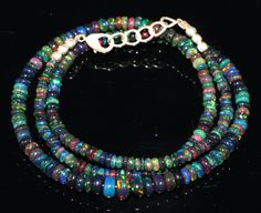 Black Opal colorful beads Necklace 17 inch long, 34.30 cts Colorful Ethiopian Opal 3-6mm rondelle beads  Stone :  Black Ethiopian Opal Beads  Weight :  34.30 carat Length : 17 inch Beads Size :  3-6mm Quantity : 1 strand Shape :  Rondelle Note- Stone Weight and dimension are in approx. Multicolor Single Strand Rondelle Beaded Necklaces, Multicolor Rondelle Beaded Necklaces Single Strand, Multicolor Rondelle Beaded Necklace Single Strand, Multicolor Single Strand Beads, Opal Beads, Black Opal, Beads Necklace, Ethiopian Opal, Beauty Book