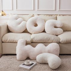 the pillows on the couch are shaped like donuts