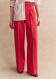 High-waisted trousers;Straight, wide leg;Hidden front zip fastening;Belt fastened with an imitation horn buckle on the side;Stitched pleats on front;Broken pleats front and back;Piped pockets on back;Inside leg length: 82 cm / 32.3 in (on all sizes) Chic Wide Leg Bottoms With Concealed Fastening, Straight Leg Pants With Concealed Fastening For Work, Formal Pants With Concealed Front Fastening, Formal Straight Pants With Concealed Front Fastening, Wide Leg Pants With Concealed Front For Work, Chic Formal Pants With Concealed Front Fastening, Formal Wide Leg Bottoms With Concealed Front Fastening, Office Straight Pants With Concealed Front Fastening, Workwear Straight Pants With Concealed Front Fastening