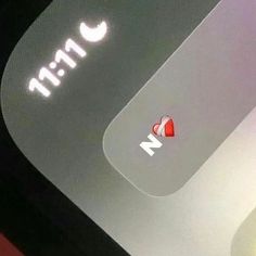 an apple logo is shown on the side of a cell phone with heart stickers