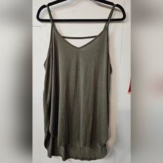 Army Green Flowy Tank Top Never Worn, With Tags Cross Strap In The Back V Neck Curved Sides Relaxed Fit Khaki V-neck Top For Summer, Sleeveless Khaki Top For Layering, Khaki Sleeveless Top For Layering, Casual Khaki Tops For Beach, Green Cami Top For Day Out, Casual Cami Tops For Layering, Spring Khaki Tops For Layering, Green Tank Top For Layering, Summer Khaki Tops For Layering