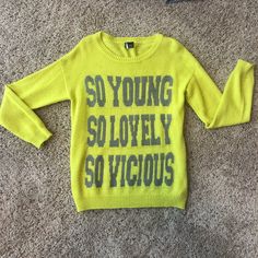 “Sparkle & Fade” Yellow Sweater From Urban Outfitters. New, Never Worn. Women’s Size: Small. Yellow Party Tops For Fall, Yellow Long Sleeve Sweater With Letter Print, Yellow Letter Print Long Sleeve Sweater, Fun Yellow Tops For Fall, Fun Yellow Fall Tops, Casual Yellow Sweater With Letter Print, Casual Yellow Letter Print Sweater, Trendy Yellow Long Sleeve Sweater, Trendy Long-sleeved Yellow Sweater