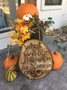 a wooden sign that says what will our pumpkin be come in and see