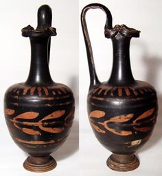 two black and brown vases sitting side by side