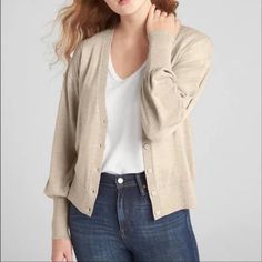 This Classic Yet Fashionable Button Down Cardigan Is Perfect For Cool Summer Night Or Fall. It Features V-Neck With Long Balloon Sleeves With Rib-Knit Cuffs, Rib-Knit Hem And Button-Front (Button Color Same As Material).Straight Silhouette With An Easy Fit That Hits At The Hip. 100% Merino Wool Color: Oatmeal Heather (Similar To Tan). Classic Gap Tops For Fall, Versatile Button Cardigan For Fall, Versatile Fall Cardigan With Buttons, Versatile Buttoned Cardigan For Fall, Beige Button-up Cardigan For Everyday, Everyday Fall Outerwear By Gap, Gap Fall Outerwear For Everyday, Versatile Everyday Cardigan With Button Closure, Classic Everyday Outerwear By Gap