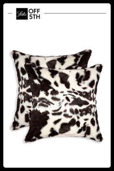 two pillows with black and white animal print on the front, one is made out of faux