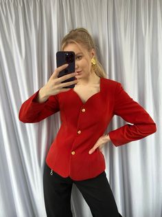 The vintage elegant red blazer is a sophisticated and stylish jacket that exudes femininity and class. It features a unique sweetheart collar that adds a touch of romance and charm to the overall design.  The golden buttons on the jacket provide a luxurious and elegant touch, adding to the overall vintage feel of the blazer. The combination of the vibrant red color, feminine silhouette, and golden accents create a bold and statement-making look that is perfect for formal occasions or as an eleva Red Single Breasted Blazer For Evening, Elegant Fitted Blazer With Gold Buttons, Elegant Fitted Outerwear With Gold Buttons, Elegant Evening Blazer With Gold Buttons, Chic Party Blazer With Gold Buttons, Elegant Party Blazer With Gold Buttons, Fitted Party Blazer With Gold Buttons, Elegant Winter Blazer With Gold Buttons, Elegant Evening Outerwear With Gold Buttons