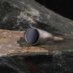 a ring sitting on top of a rock