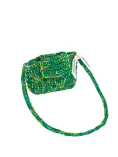 a green and white bag with a string on it's side, in front of a white background