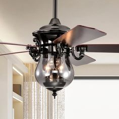 a ceiling fan with three light bulbs hanging from it