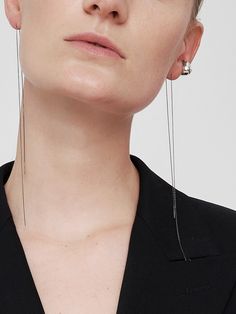 Editor's NoteThe elegant and classic jewelry from MOI studio is designed to match your mood- MOI 2st Earcuff X Chain Earring_27SET- Earcuff and chain earring in one set- Shiny and glossy metal texture- Layered look or single look- Daily point itemMeasurements (in.)- Size Chain 12.2in./earcuff 0.6in.*0.4in.Composition & Care- SILVER925- Beware of the wearing and storage of jewelry.- The size, shape, and color of the gemstone vary from product to product, and this is not de Elegant Sterling Silver Clip-on Ear Cuff, Modern Pierced Ear Cuff For Formal Occasions, Minimalist White Gold Earrings For Evening, Modern Silver Ear Cuff For Formal Occasions, Modern Single Ear Climbers For Formal Events, Modern Single Ear Climber For Formal Occasions, Modern Single Ear Cuff For Evening, Elegant Dangle Clip-on Ear Cuff, Modern Sterling Silver Ear Cuff For Formal Occasions