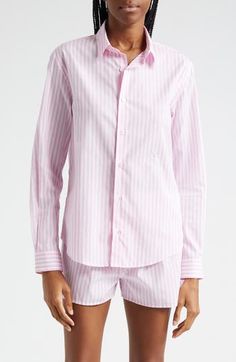 Perky pink stripes rev up your day in a cotton shirt cut in a relaxed profile aligned with new ways of working. 29 1/2" length (size Large) Front button closure Spread collar Curved hem Long sleeves with button cuffs 100% cotton Dry clean or machine wash, line dry Made in Portugal Asian & Pacific Islander Owned/Founded Pink Relaxed Fit Shirt For Work, Cotton Shirt With Vertical Stripes For Daywear, Pink Spread Collar Top For Daywear, Pink Cotton Sporty Shirt, Pink Relaxed Fit Tops With Vertical Stripes, Classic Pink Top With Striped Collar, Pink Relaxed Fit Top With Vertical Stripes, Pink Cotton Shirt With Striped Collar, White Striped Collar Button-up Blouse