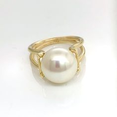 Impressive 9 carat yellow gold ring set with freshwater button pearl. Pearl is 12 mm in diameter, exceptionally  high lustre . Split shank Ring size is N (US Size 6 3/4) Ring weight is 5.7 grams Luxury Round Ring With Pearl Drop, Luxury Round Pearl Drop Ring, Yellow Gold Round Rings With Pearl Drop, Elegant Yellow Gold Round Pearl Ring, Formal Round Pearl Drop Ring, Yellow Gold Akoya Pearl Ring, Classic Round Pearl Ring With High Luster, Gold Akoya Pearl Ring, Classic Gold Pearl Ring With High Luster