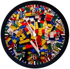 a clock made out of legos on a white background with the numbers in different colors