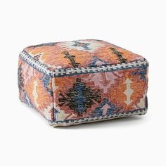 an orange, blue and white square ottoman