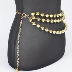 A sophisticated blend of elegance and style, the Multi Layered Bead Chain Belt is a statement accessory for any fashion-forward wardrobe. This exquisite piece features multiple layers of lustrous beads in your choice of goldstone or silver. Whether you're dressing up for a special occasion or adding a touch of glamour to your everyday outfit, this belt is sure to make a lasting impression. - 0.65" Wide x 47" Long - Imported Elegant Multi-strand Beaded Chain, Elegant Gold Beaded Necklaces For Evening, Gold Metal Necklace For Accessorizing, Elegant Double Strand Metal Layered Necklace, Adjustable Silver Elegant Waist Chain, Gold Necklaces With Round Beads For Evening, Chic Pearl Beaded Necklaces For Party, Gold Beads Jewelry For Evening, Elegant Gold Chain Necklace With Polished Beads