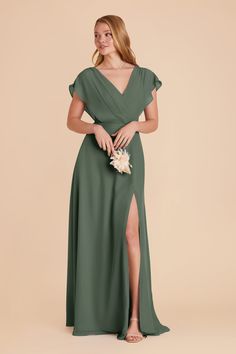 a woman wearing a green bridesmaid dress with a slited skirt and side slit