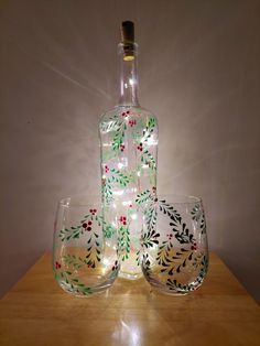 *Bottle shapes and sizes may vary* Are you looking for an unusual, unique Christmas gift or an upcycled Christmas gift or a way to brighten up a room in the house during the festive period? This holly and the ivy themed bottle with fairy lights is hand painted and can be used in a number of ways: - Vase - Lamp - Candle holder - Decoration - Wedding centre piece - Children's lamp / night light - Bedside lamp - Garden light - Christmas Decoration - Christmas Table Decoration - Stocking Filler - Ch Recycled Christmas Gifts, Christmas Bottles, Bottle With Lights, Bottle Shapes, Company Ideas, Christmas Wine Bottle, Acorn Crafts