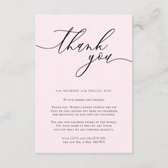 a pink thank card with the words thank you in cursive writing on it