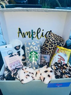 the starbucks gift box is filled with various items