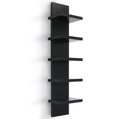 a black shelf with three shelves on the side and one in the middle, against a white wall