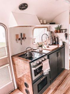 the kitchen is clean and ready to be used as a dining area in an rv