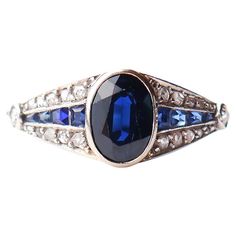 Beautiful Sapphire + Diamonds + Platinum Ring from 1900s -1920s. All metal parts of this ring are made of solid Platinum. Crown measures 19 mm x 8 mm x 4 mm. Beautifully oval cut natural Blue Sapphire stone of darker tone is 7.5 mm x 5.5 mm x 3.75 ct / 1.2 ct . There are 8 more gradually sized care cut Sapphires + two Ø 2 mm /0.03ct each old diamond cut Diamonds and 20 additional gradually sized rose cut Diamonds on the shoulders. Metal was tested solid Platinum. No clear hallmarks of maker or period. Condition is fine used. No stones missing. The Sapphire has minor wear to some facets / visible under magnification only and not noticeable to naked eye from casual distance. Size : Ø 7.25 US scale / about 17.45 mm. Sizing is possible. Weight: 3 grams. > Most of the items that we sell are not Old Rings, Platinum Diamond Rings, Ring Ideas, Deco Ring, Old Jewelry, Art Deco Diamond, Platinum Ring, Natural Blue Sapphire, Sapphire Stone