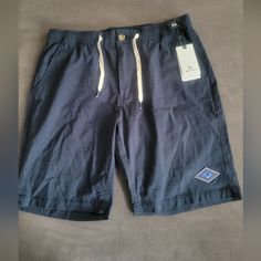 Experience The Ultimate Comfort And Style With These Rip Curl Swc Ripple Walkshorts. Designed For Men, These Walk Shorts Come In A Stunning Blue Color And Feature A Solid Pattern. The Zipper Closure Ensures A Secure Fit While The Flat Front And Regular Fit Provide A Classic Look. The Shorts Have Slash Pockets And Are Made Of Machine-Washable Fabric For Easy Maintenance. Perfect For Casual Occasions, These Shorts Are A Must-Have In Your Wardrobe Casual Cotton Athletic Shorts For Beach, Blue Cotton Athletic Shorts For Summer, Blue Cotton Athletic Shorts For Beach, Blue Bermuda Casual Athletic Shorts, Casual Blue Athletic Shorts For Vacation, Blue Cotton Knee-length Shorts, Blue Cotton Athletic Shorts, Casual Blue Bermuda Shorts, Navy Cotton Shorts With Short Leg