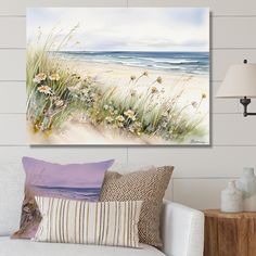 a living room scene with focus on the ocean and sand dunes painted on the wall