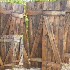 three wooden doors are shown side by side on the ground in front of some bushes