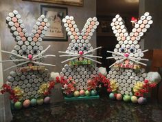 two decorated easter bunnies sitting on top of a table