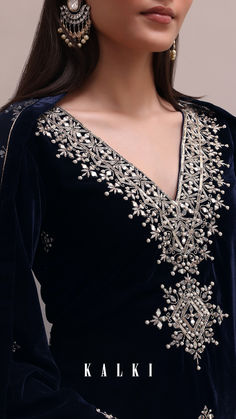 Enhance your wedding wear with our Blue Velvet Embroidered Dhoti Set. It features intricate mirror work, sequins, and cut dana detailing on a luxurious velvet fabric. The flared sleeves kurta is paired with a dhoti and an embroidered net dupatta. Package includes one kurta, dhoti, and dupatta. Intricate Mirror, Mirror Work Embroidery, Velvet Suit Design, Velvet Kurta, Modern Hand Embroidery Patterns, Saree Painting Designs, Kaftan Designs, Velvet Dress Designs, Draping Fashion