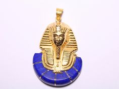 Blue Lapis king Tut 18K Gold Pendant | Egyptian Jewelry Handmade jewelry Pharaoh Pendant mythology jewelry king Tut pendant Egypt gift 17 Gr Weight Approximate : 17 Gr Height : 1.7" = 44 mm Width : 1.2" = 31 mm ✔ IT IS Tested & SIGNED WITH THE EGYPTIAN Gold Government HALLMARK FOR 18K GOLD to Ensure      Authenticity. ✔ Lovely gift idea ABSOLUTELY GORGEOUS, LOOKS FABULOUS ON. ✔ 100% Egyptian handmade. ✔ Condition: A brand-new, exactly as on the photos. ★ GIFTS ✔ All items are packaged in a paper Traditional Gold Lapis Lazuli Jewelry, Traditional Gold Jewelry With Lapis Lazuli, Royal Gold Jewelry Gift, Royal Gold Jewelry For Gift, Royal Gold Jewelry As A Gift, Egyptian Jewelry Ancient, Egyptian Gold, Mythology Jewelry, Egyptian Necklace