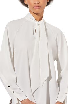 Raglan long sleeves underscore the contemporary style of a tie-neck top that's ideal for the office and beyond. 26" length (size XS) Split neck with ties Long sleeves with button cuffs 100% polyester Machine wash, dry flat Imported White Tie Neck Top With Tie Sleeves, White Tie Sleeves Blouse For Office, Workwear Blouse With Tie Sleeves And Tie Neck, White Long Sleeve Blouse With Tie Sleeves, White Tie Neck Blouse For Formal Occasions, Chic White Blouse For Business, Elegant Tie Neck Top For Office Wear, Office Tops With Tie Sleeves And Long Sleeve, Elegant Office Tops With Tie Sleeves