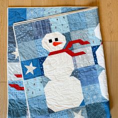 a quilted snowman with stars on it