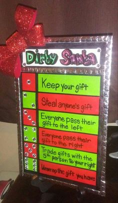 a sign that says dirty santa keep your gift and give it to someones friend