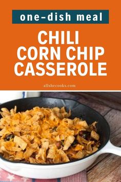 a skillet filled with chili corn chip casserole on top of a wooden table